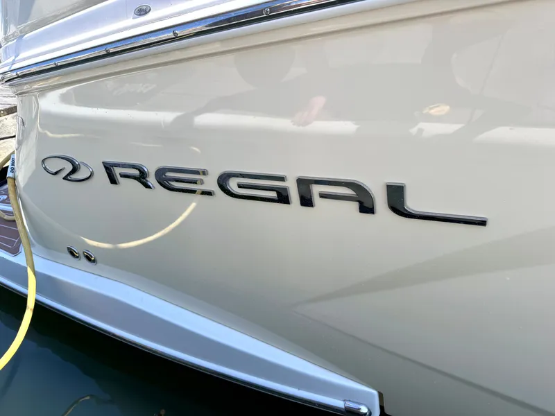 Slide: The Image of 2018 Regal 28 Express boat with logo on the stern. - 36