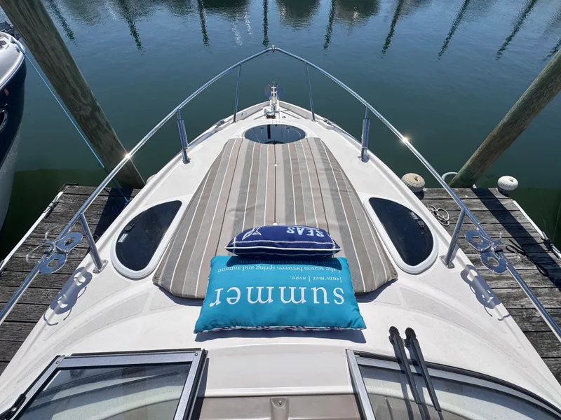 Slide: The Image of 2018 Regal 28 Express boat with cushions on the deck. - 4