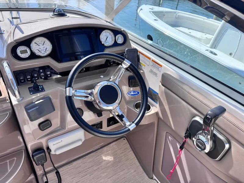 Slide: The Image of 2018 Regal 28 Express cockpit with steering wheel and instruments. - 6