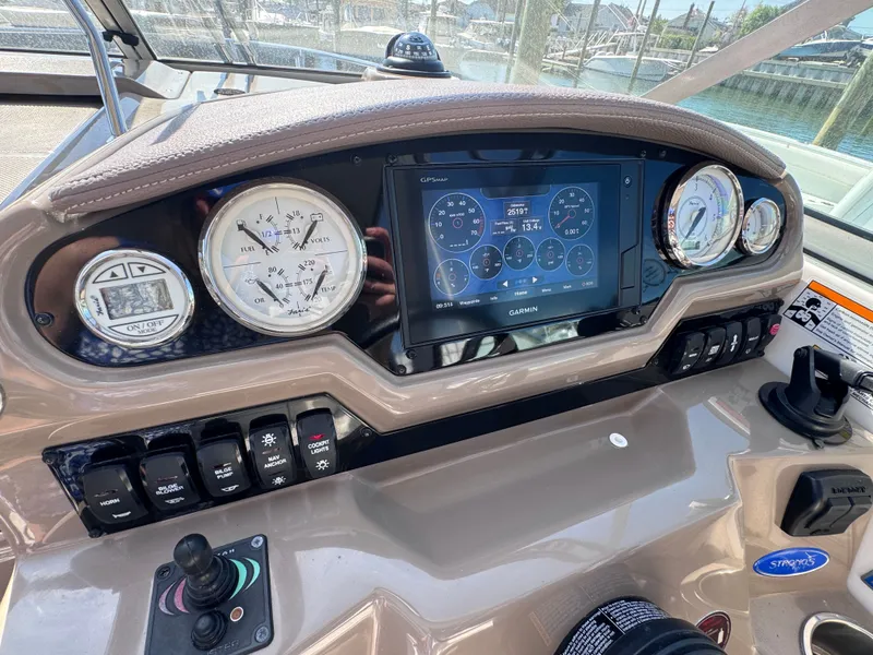 Slide: The Image of Dashboard of a 2018 Regal 28 Express boat with Garmin GPS. - 7