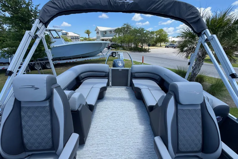 Slide: The Image of 2026 Bennington 22 SSR pontoon boat with luxurious seating and sleek design. - 12