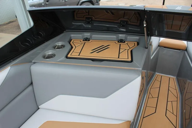 Slide: The Image of 2024 ATX Surf Boats 22 Type-S interior with stylish seating and cup holders. - 11