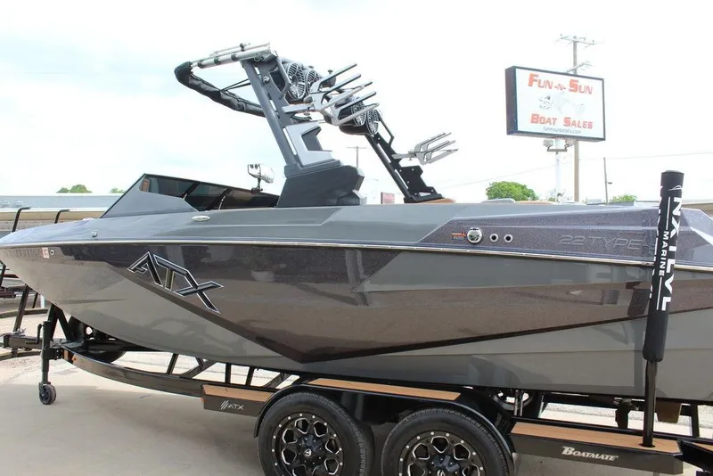 Slide: The Image of 2024 ATX Surf Boats 22 Type-S in showroom, sleek design, displayed at Fun-N-Sun Boat Sales. - 12