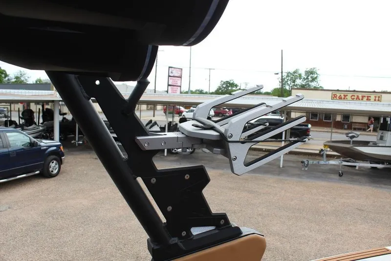 Slide: The Image of 2024 ATX Surf Boats 22 Type-S wakeboard rack in a parking lot setting. - 17