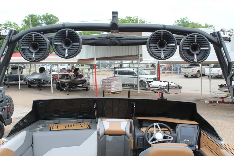 Slide: The Image of 2024 ATX Surf Boats 22 Type-S interior with speakers and steering wheel, showcasing modern design. - 18