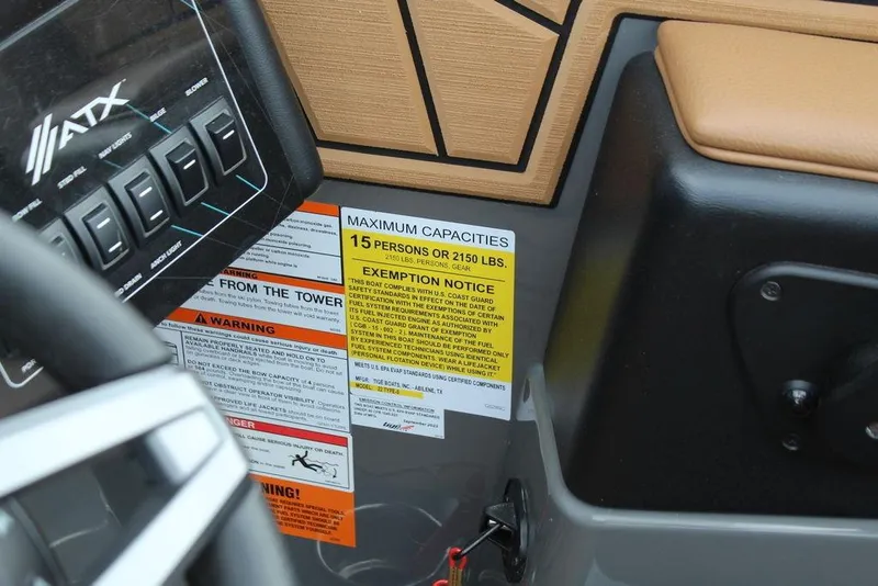 Slide: The Image of Control panel and capacity warning on 2024 ATX Surf Boats 22 Type-S dashboard. - 19