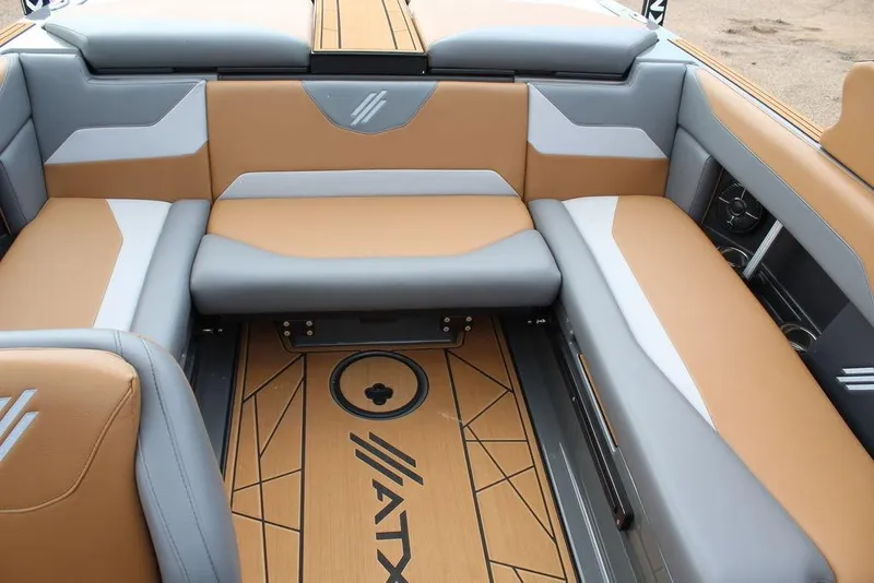 Slide: The Image of 2024 ATX Surf Boats 22 Type-S interior with tan and gray seating, stylish design. - 21