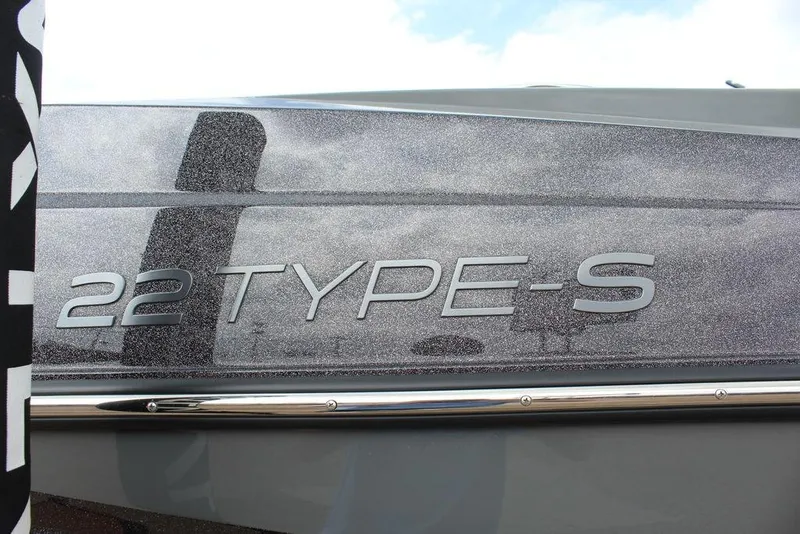 Slide: The Image of 2024 ATX Surf Boats 22 Type-S model nameplate on sleek exterior. - 23