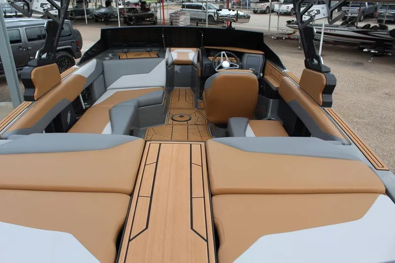 Slide: The Image of 2024 ATX Surf Boats 22 Type-S interior with tan and gray seating, modern design. - 26