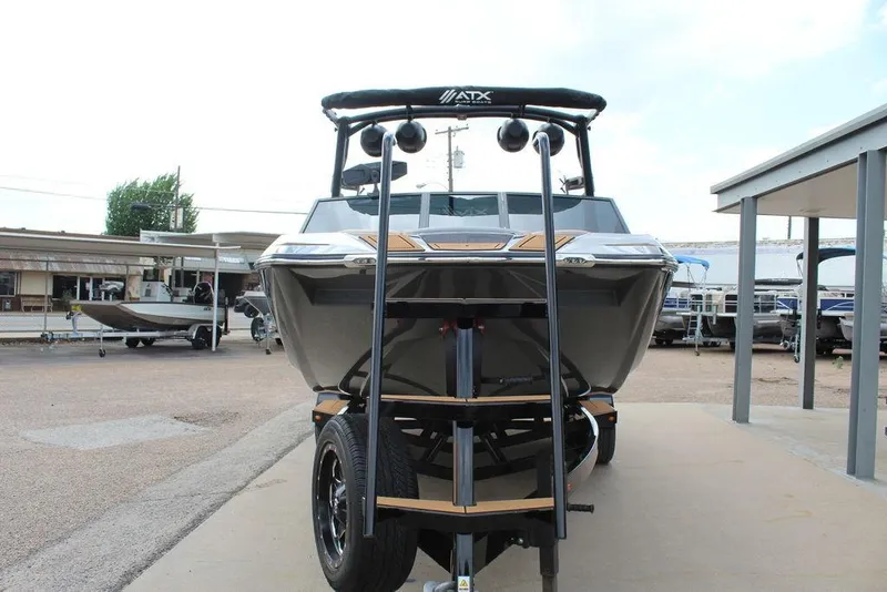 Slide: The Image of 2024 ATX Surf Boats 22 Type-S on trailer, front view in outdoor setting. - 28