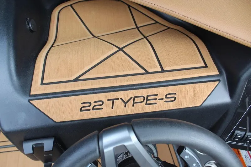 Slide: The Image of 2024 ATX Surf Boats 22 Type-S dashboard with steering wheel detail. - 29