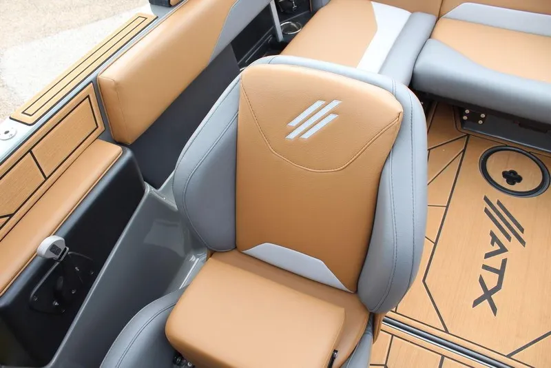Slide: The Image of 2024 ATX Surf Boats 22 Type-S interior with tan and gray seating, featuring logo details. - 36