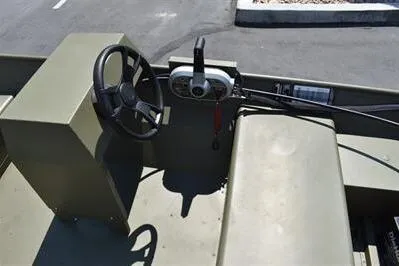 Slide: The Image of 2025 Lowe L1652MT Jon boat interior with steering wheel and control panel. - 13
