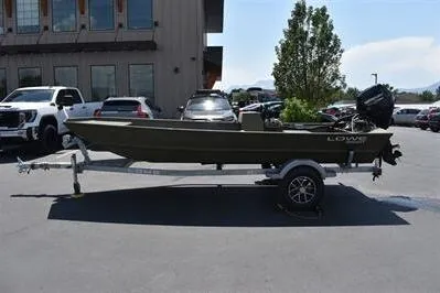 Slide: The Image of 2025 Lowe L1652MT Jon boat on trailer, parked outdoors. - 4