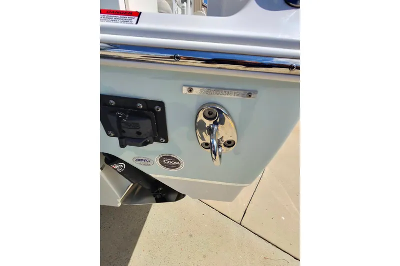 Slide: The Image of 2019 Sea Hunt Gamefish 27 boat stern with hardware and identification plate. - 20