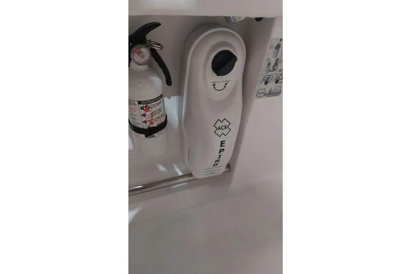 Slide: The Image of Fire extinguisher and EPIRB on 2019 Sea Hunt Gamefish 27 boat. - 26