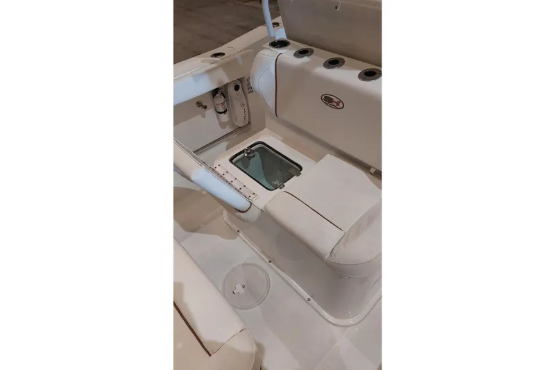 Slide: The Image of 2019 Sea Hunt Gamefish 27 boat interior with seating and storage compartment. - 30