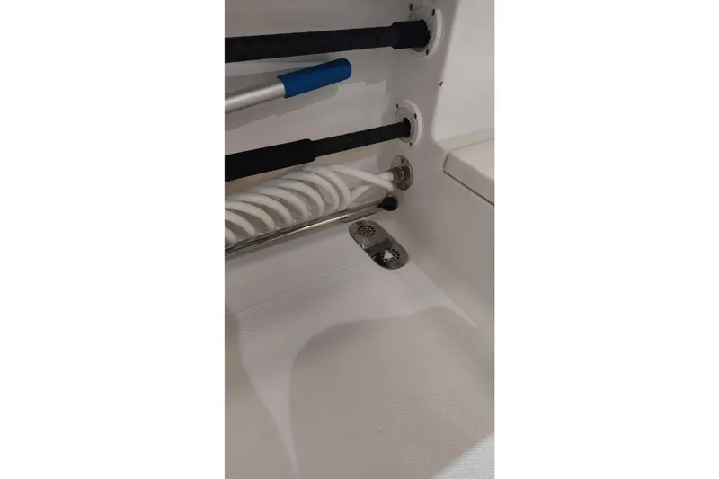 Slide: The Image of 2019 Sea Hunt Gamefish 27 boat interior with rod holders and drainage system. - 34