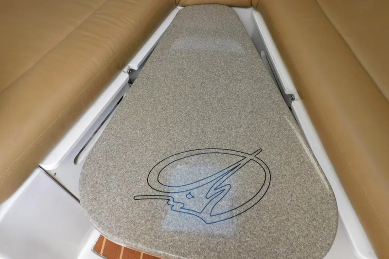 Slide: The Image of Interior view of a 2012 Sailfish 30-06 Express boat with cushioned seating. - 12