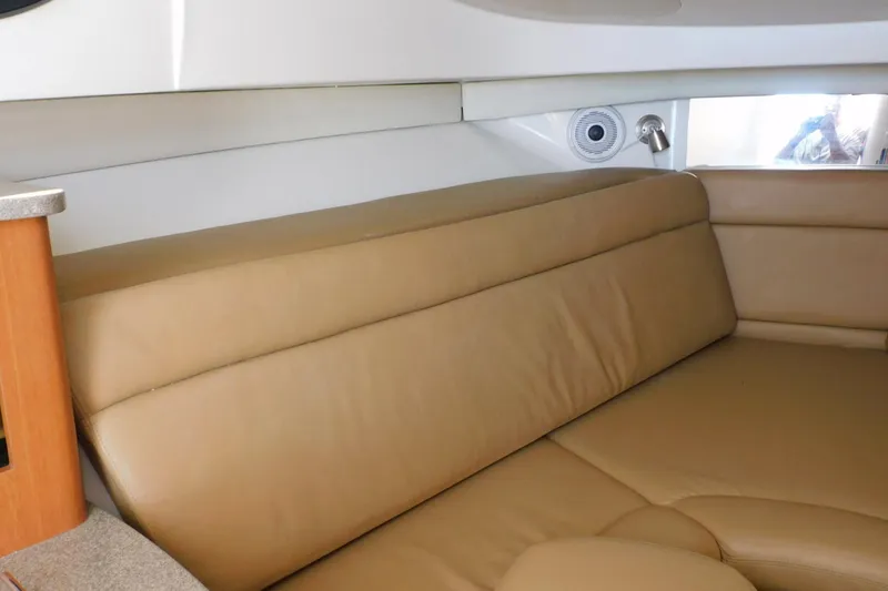 Slide: The Image of Interior of 2012 Sailfish 30-06 Express boat with beige leather seating. - 13