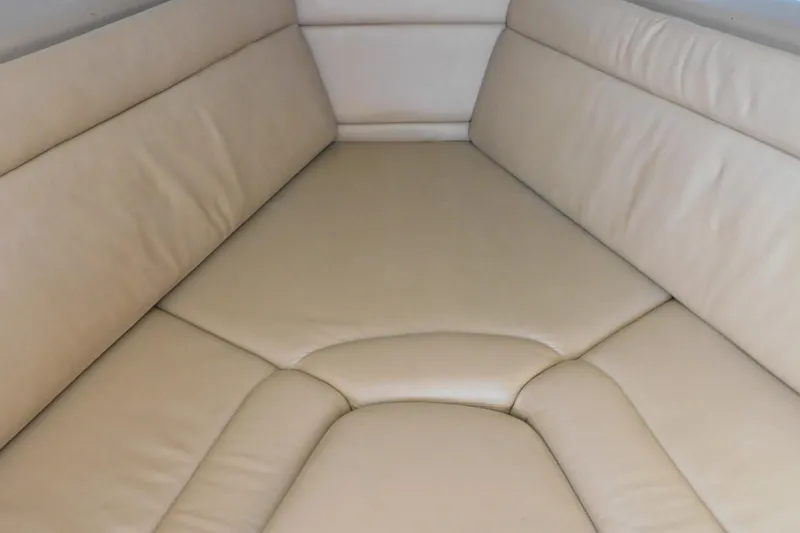 Slide: The Image of Beige leather seating in 2012 Sailfish 30-06 Express boat interior. - 14