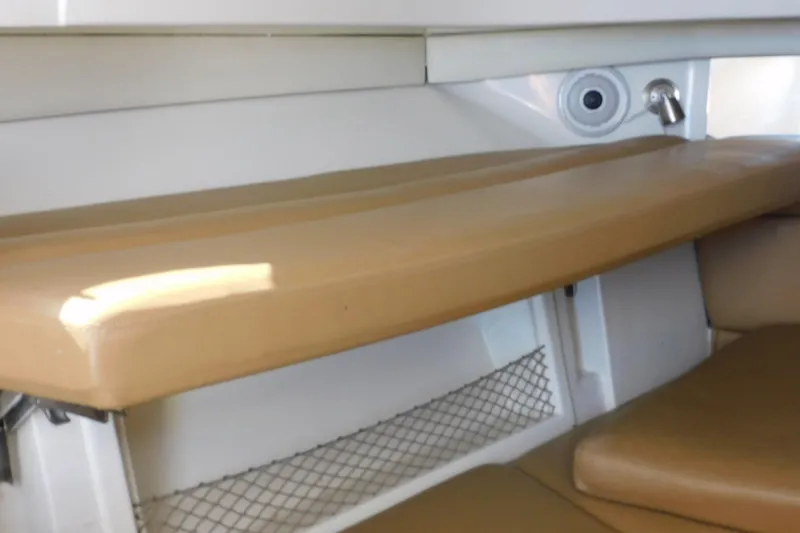 Slide: The Image of Interior cabin seating of 2012 Sailfish 30-06 Express boat with tan cushions. - 17
