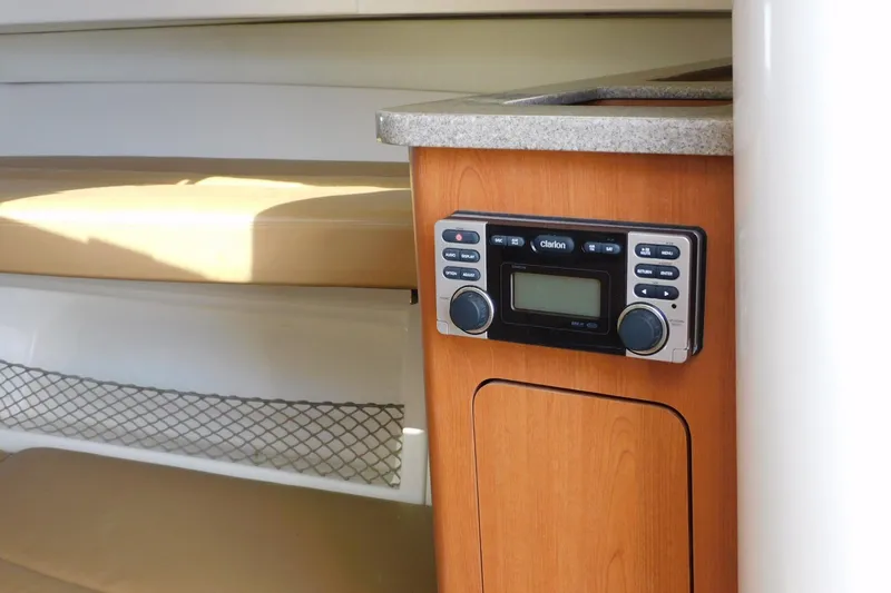 Slide: The Image of Interior of 2012 Sailfish 30-06 Express boat with Clarion audio system. - 24