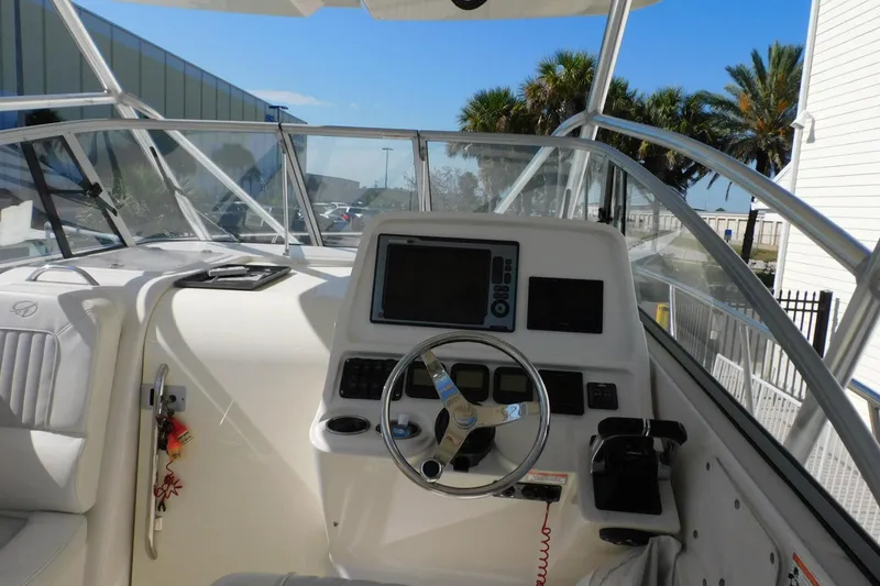 Slide: The Image of Cockpit of 2012 Sailfish 30-06 Express boat with steering wheel and navigation equipment. - 3