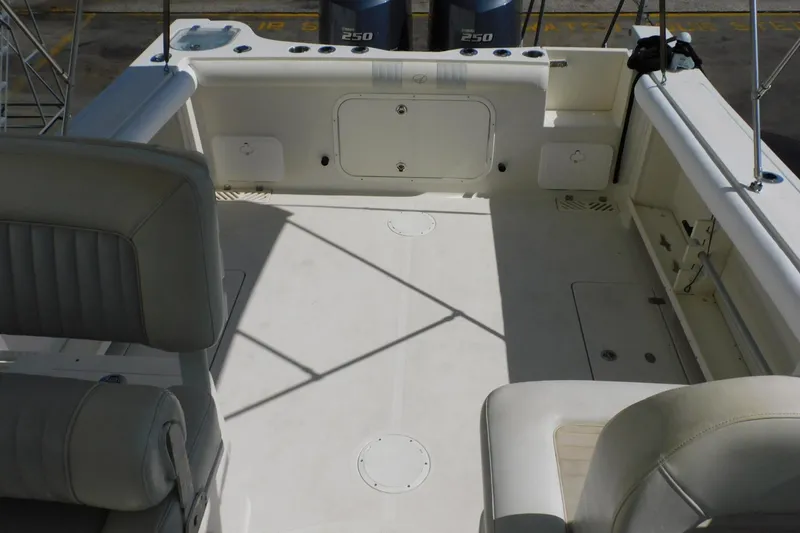 Slide: The Image of Spacious deck of 2012 Sailfish 30-06 Express boat with seating and storage compartments. - 7
