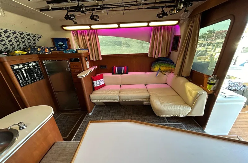 Slide: The Image of 1993 Luhrs Tournament 380 Convertible yacht interior with leather seating and modern amenities. - 14