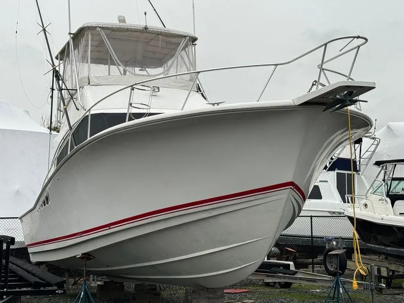 Slide: The Image of 1993 Luhrs Tournament 380 Convertible boat on display, featuring sleek design and sturdy build. - 2