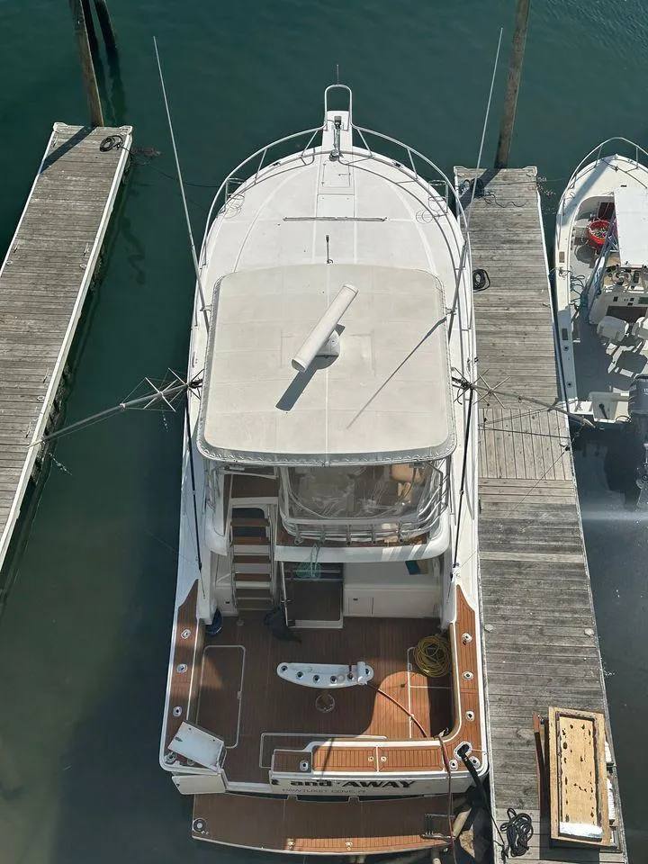 Slide: The Image of 1993 Luhrs Tournament 380 Convertible yacht docked at marina, aerial view. - 4