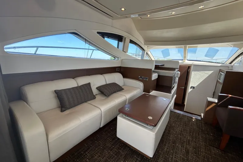 Slide: The Image of Luxurious interior of 2012 Sea Ray 450 Sedan Bridge yacht with plush seating and modern design. - 10