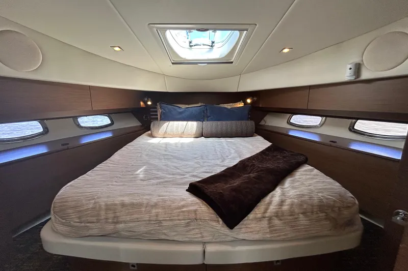 Slide: The Image of Luxurious cabin interior of 2012 Sea Ray 450 Sedan Bridge yacht with skylight. - 12