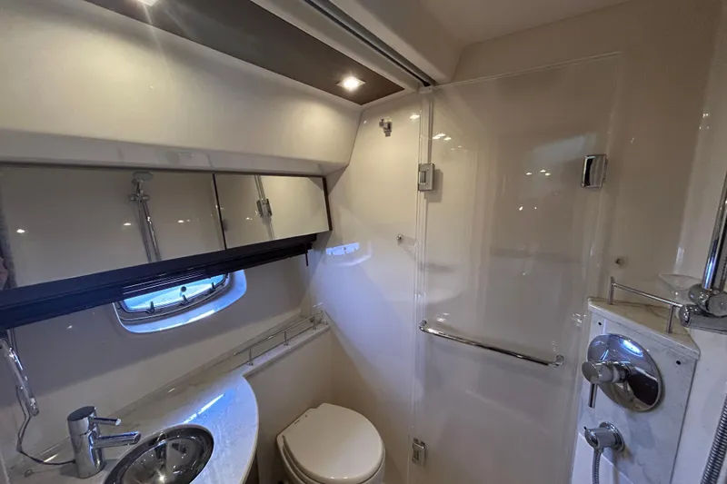 Slide: The Image of Luxurious bathroom in 2012 Sea Ray 450 Sedan Bridge yacht with modern fixtures. - 14