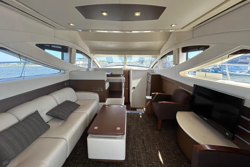 Slide: The Image of Luxurious interior of 2012 Sea Ray 450 Sedan Bridge yacht with modern furnishings. - 9