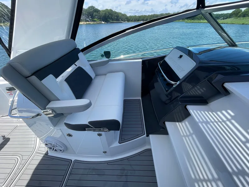 Slide: The Image of Interior of 2021 Monterey 335 Sport Yacht overlooking the water. - 13