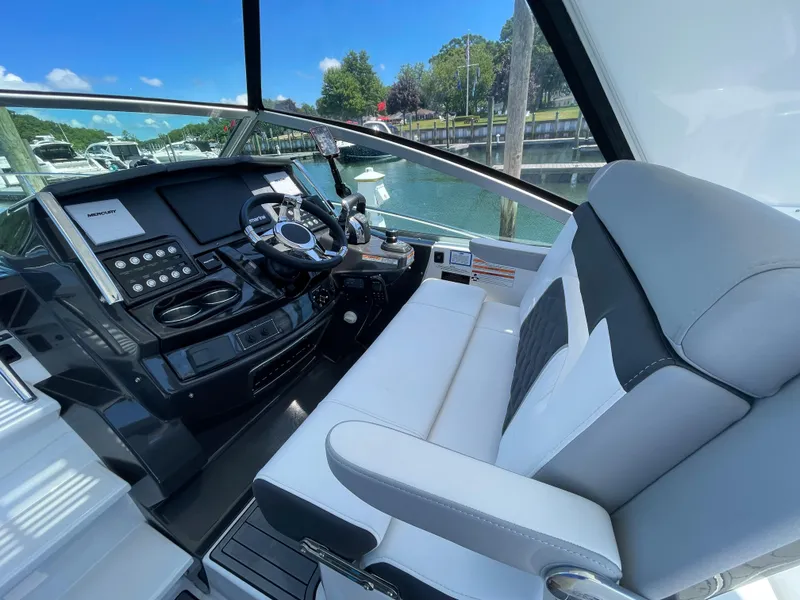 Slide: The Image of Interior of 2021 Monterey 335 Sport Yacht with helm station. - 14