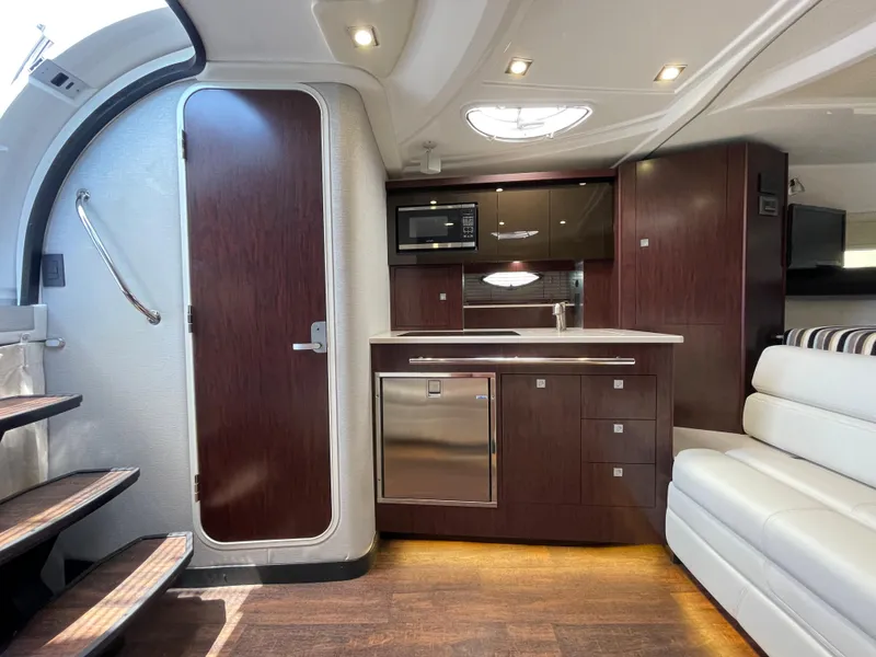 Slide: The Image of Interior of 2021 Monterey 335 Sport Yacht featuring modern kitchen. - 23