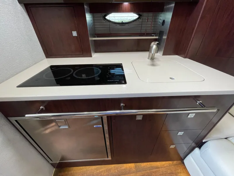 Slide: The Image of Interior of 2021 Monterey 335 Sport Yacht featuring modern kitchen. - 24