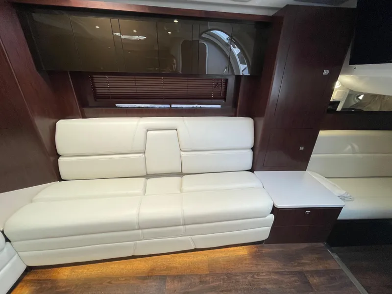 Slide: The Image of Interior of 2021 Monterey 335 Sport Yacht with white leather sofa. - 25
