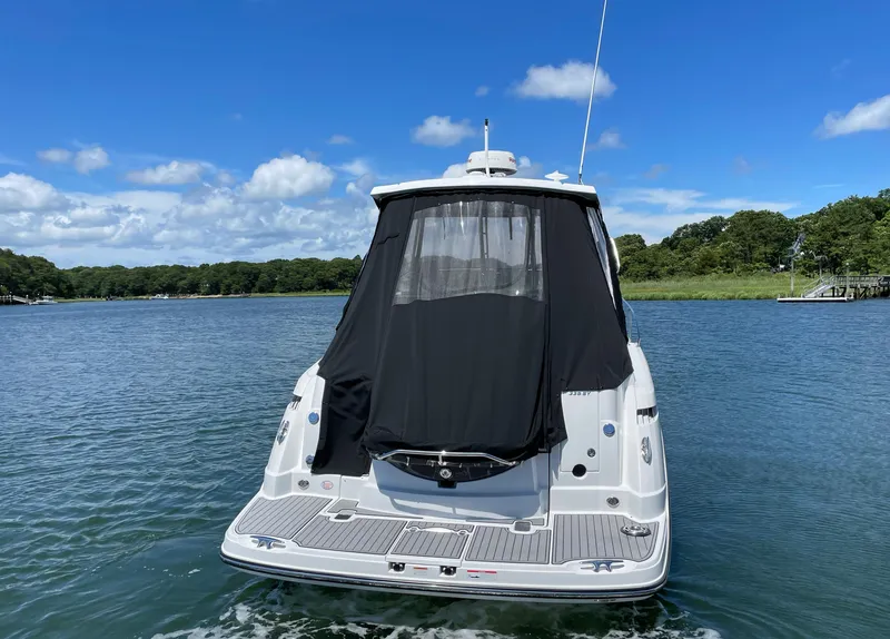Slide: The Image of Rear view of 2021 Monterey 335 Sport Yacht on calm water. - 3