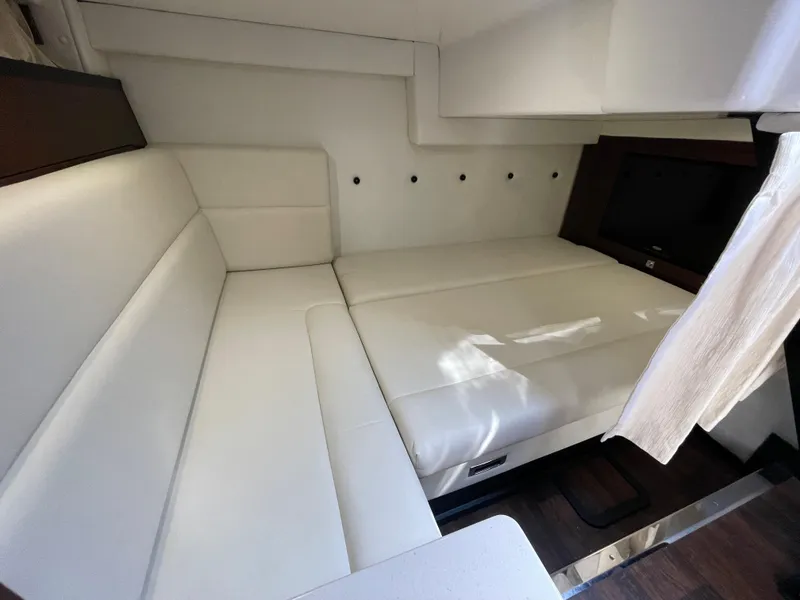 Slide: The Image of Interior of 2021 Monterey 335 Sport Yacht with white upholstered sofa. - 33