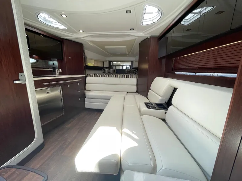 Slide: The Image of Interior of 2021 Monterey 335 Sport Yacht with sleek white leather sofas. - 35