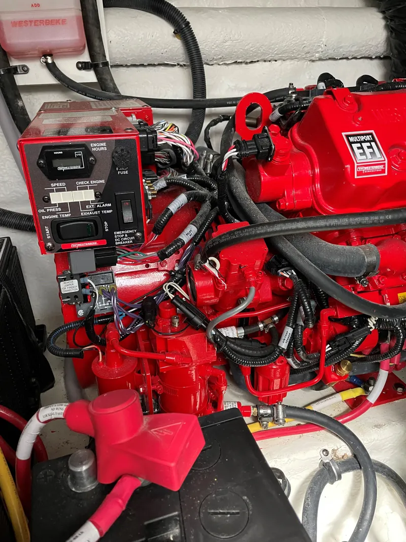 Slide: The Image of Engine compartment of 2021 Monterey 335 Sport Yacht with red EFI engine. - 44