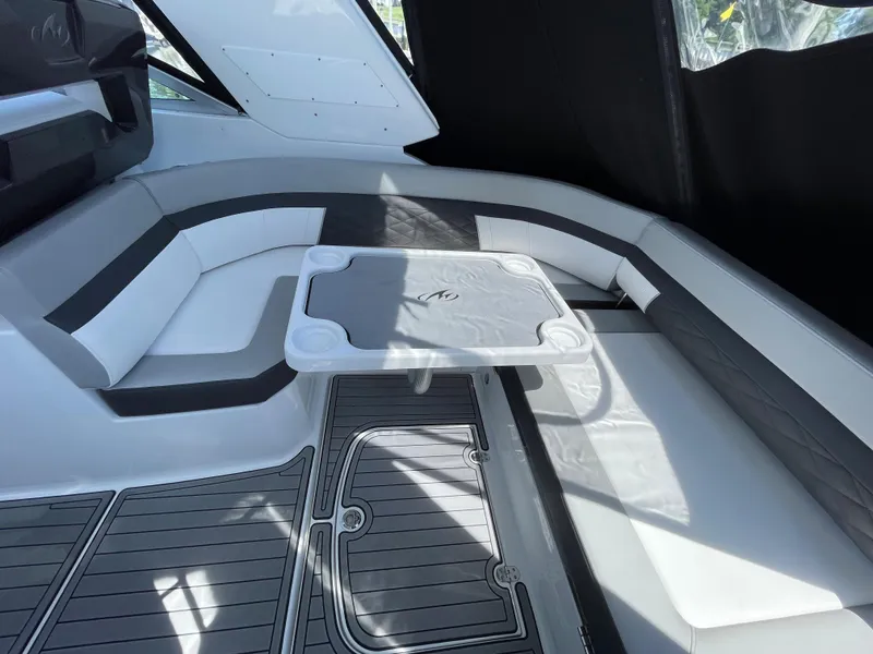 Slide: The Image of Interior of 2021 Monterey 335 Sport Yacht with seating and table. - 8