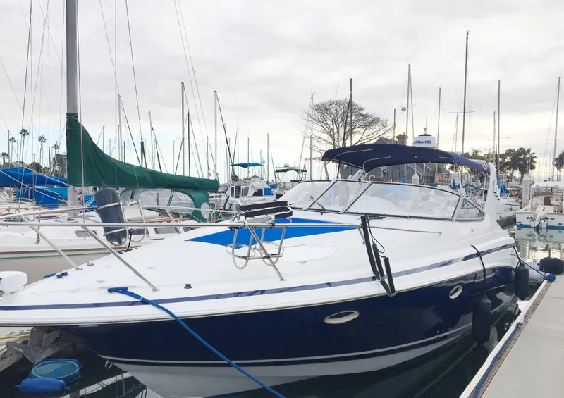 The Image of 1999 Chris-Craft 320 Express Cruiser docked at marina. - 0