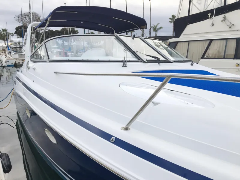 Slide: The Image of 1999 Chris-Craft 320 Express Cruiser docked at marina. - 1