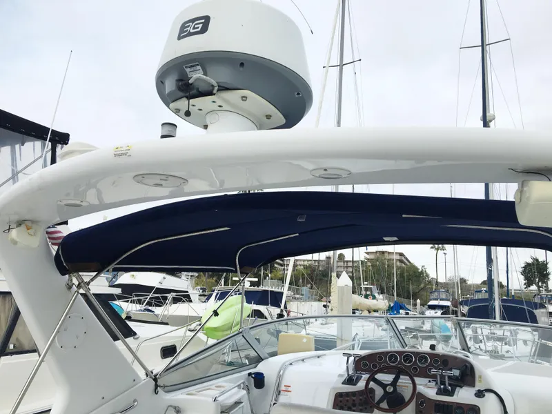 Slide: The Image of 1999 Chris-Craft 320 Express Cruiser with radar equipment in harbor. - 11