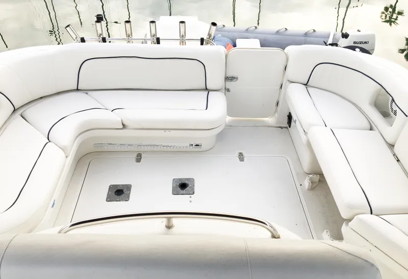 Slide: The Image of Interior of 1999 Chris-Craft 320 Express Cruiser with white seating. - 13